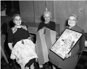 Golden Age Club 1951 Winners of the hobby show. L. to r.: Mrs. Erlen for crocheted tablecloth, Mrs. Ringer for knitted afghan, Mrs. Pler in the embroidery group for a peacock picture. Photo by Herb Topy.